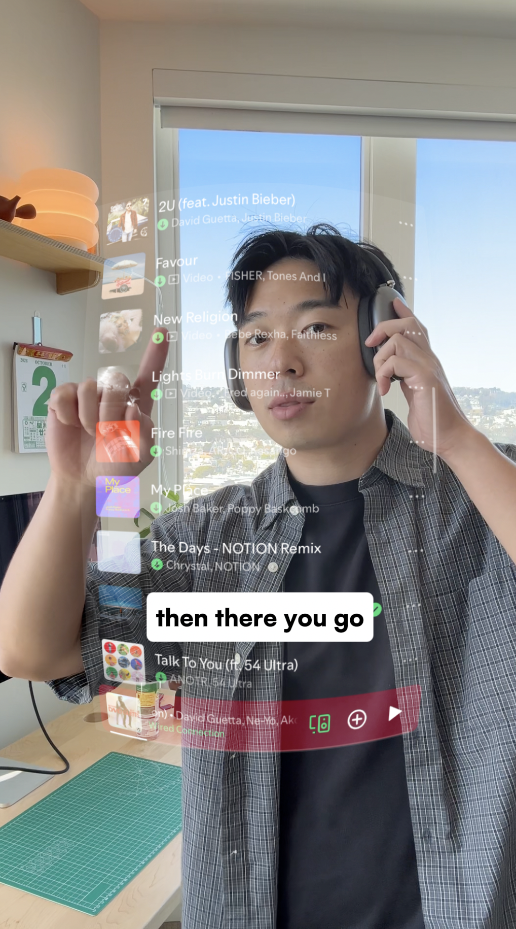 The finished effect: a curved, transparent Spotify playlist over the person as they make a scrolling gesture.